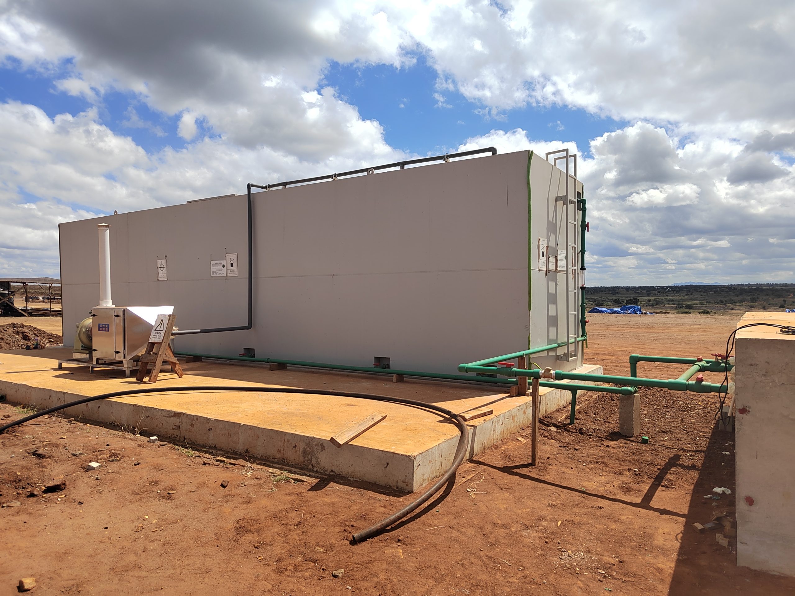 Engineer performing on-site water treatment commissioning